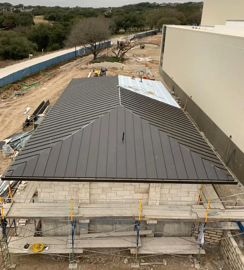 Metal roof new construction with scaffolding in Gallup